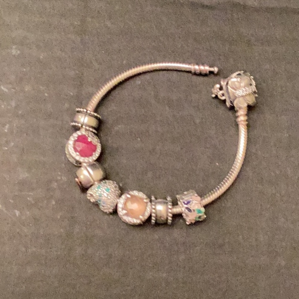Pandora silver bracelet with 7 charms.